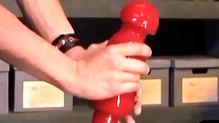 Unusual bdsm brace takes monumental dildo