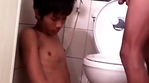 Asian bareback twink fucks pissing board up doggystyle